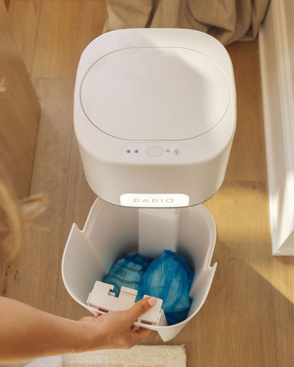An open DiaperSealer canister, showing fully contained and sealed diapers inside.