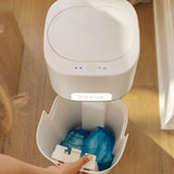 An open DiaperSealer canister, showing fully contained and sealed diapers inside.